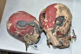 TWO 1940'S PERCUSSION SKULLS, of two different sizes (in tatty condition)