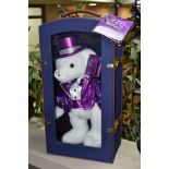 A CASED MILLENNIUM KEEPSAKE BEAR, sparkly white plush bear which appears complete and in very good