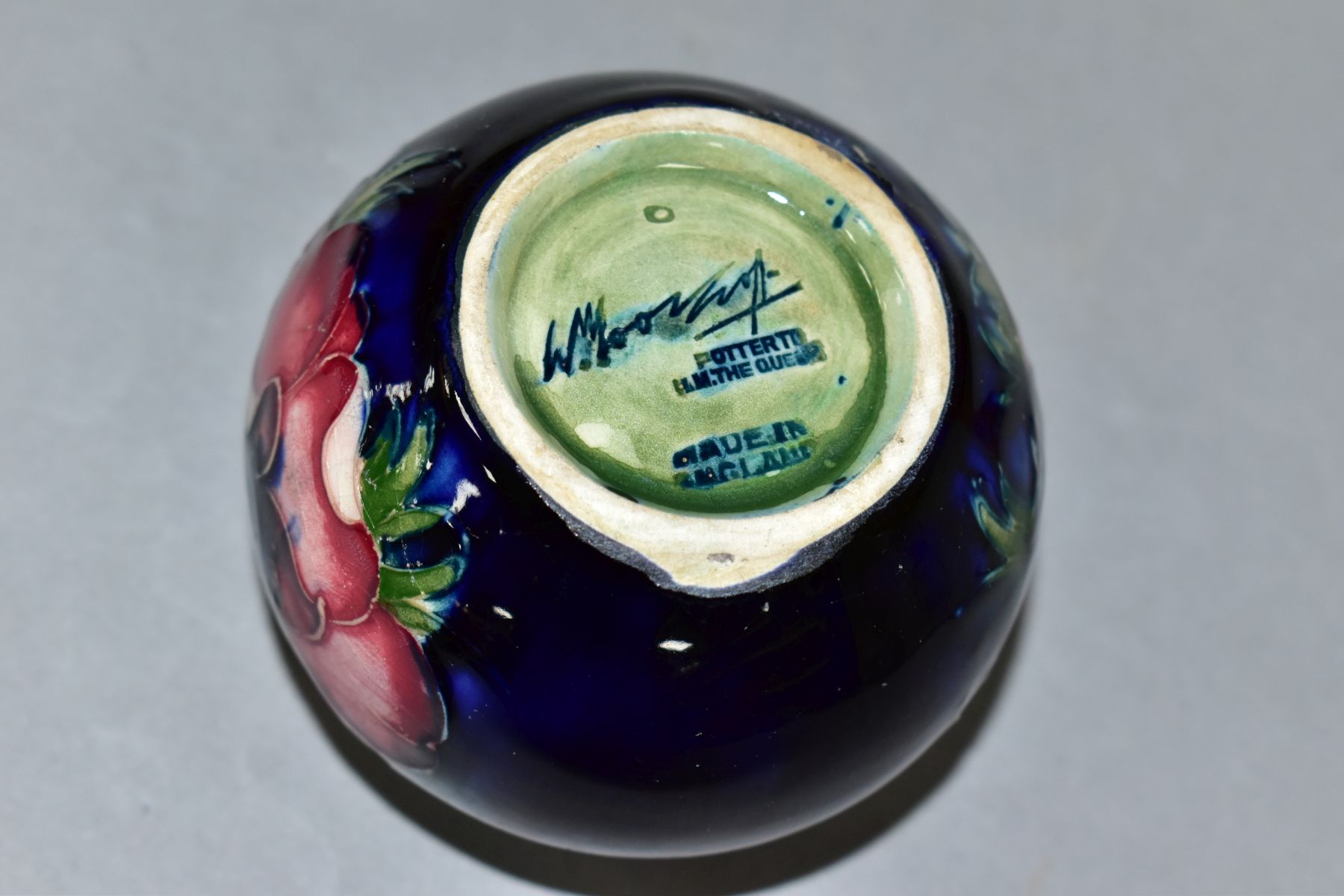 A MOORCROFT POTTERY SQUAT GLOBULAR VASE DECORATED WITH PURPLE/PINK ANEMONE, on a blue ground, - Image 5 of 5