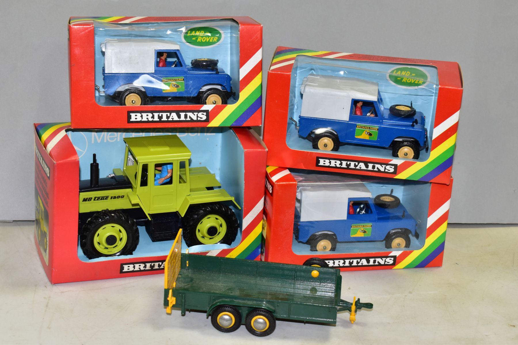 THREE BOXED BRITAINS FARM LAND ROVER MODELS, No.9571, appear complete and look to have hardly