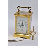 A REPRODUCTION CALENDAR CARRIAGE CLOCK with moon phase, the striking and repeating movement with