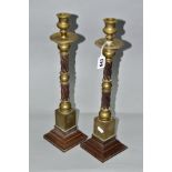 A PAIR OF LATE 19TH/EARLY 20TH CENTURY BRASS AND BROWN BAKELITE CANDLESTICKS, spiral twist moulded