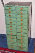 A LATE 19TH CENTURY PINE BANK OF TWENTY FOUR DRAWERS, partially painted green, some drawers with