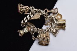 A SILVER CHARM BRACELET, bracelet hallmarked London 1970, suspending fifteen white metal charms in