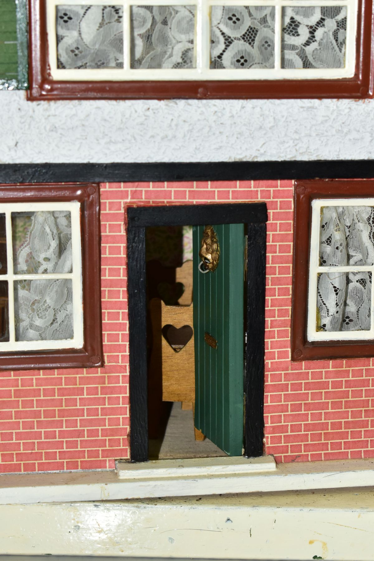 A WOODEN DOLLS HOUSE, modelled as a two storey town house, front opening to reveal two rooms, - Bild 9 aus 9