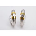 A PAIR OF 18CT WHITE GOLD, DIAMOND SET EARRINGS, each of a half hoop design, satin and gold