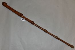A BRIAR WOOD HAND CARVED WALKING STICK, carved face handle with foliage to top of shaft, carved