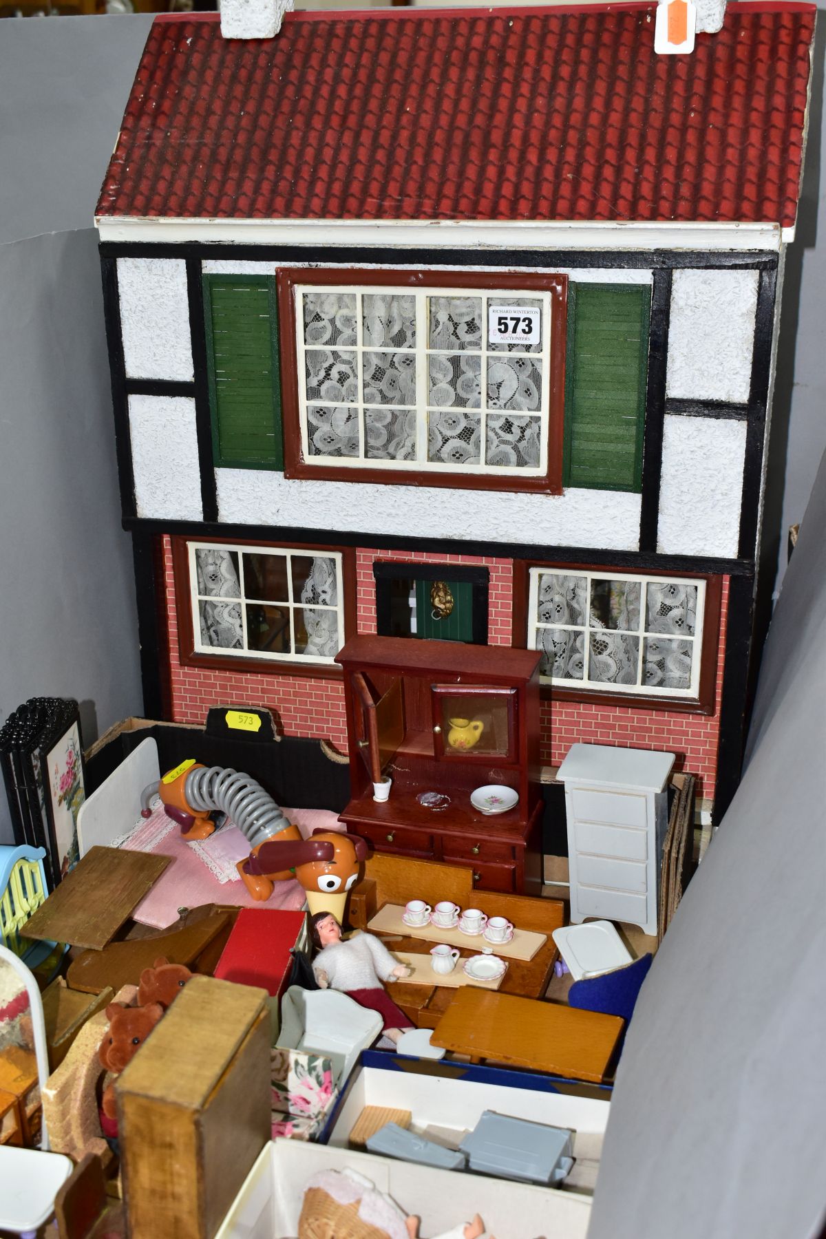 A WOODEN DOLLS HOUSE, modelled as a two storey town house, front opening to reveal two rooms, - Bild 2 aus 9