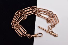 A 9CT GOLD BRACELET, designed with three fetter style chains, fitted with a T-bar and a lobster claw