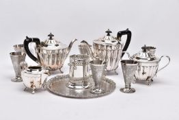 A BOX OF WHITE METALWARE, to include a foliate and scroll detailed circular tray stamped to the base