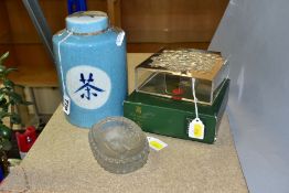 A CHINESE CRACKLE GLAZE TEA JAR/CANNISTER AND COVER, pale blue glaze, Chinese symbols to lid and