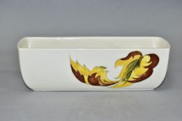 A MOORCROFT POTTERY RECTANGULAR FLOWER TROUGH, decorated with Leaves in the Wind pattern on a