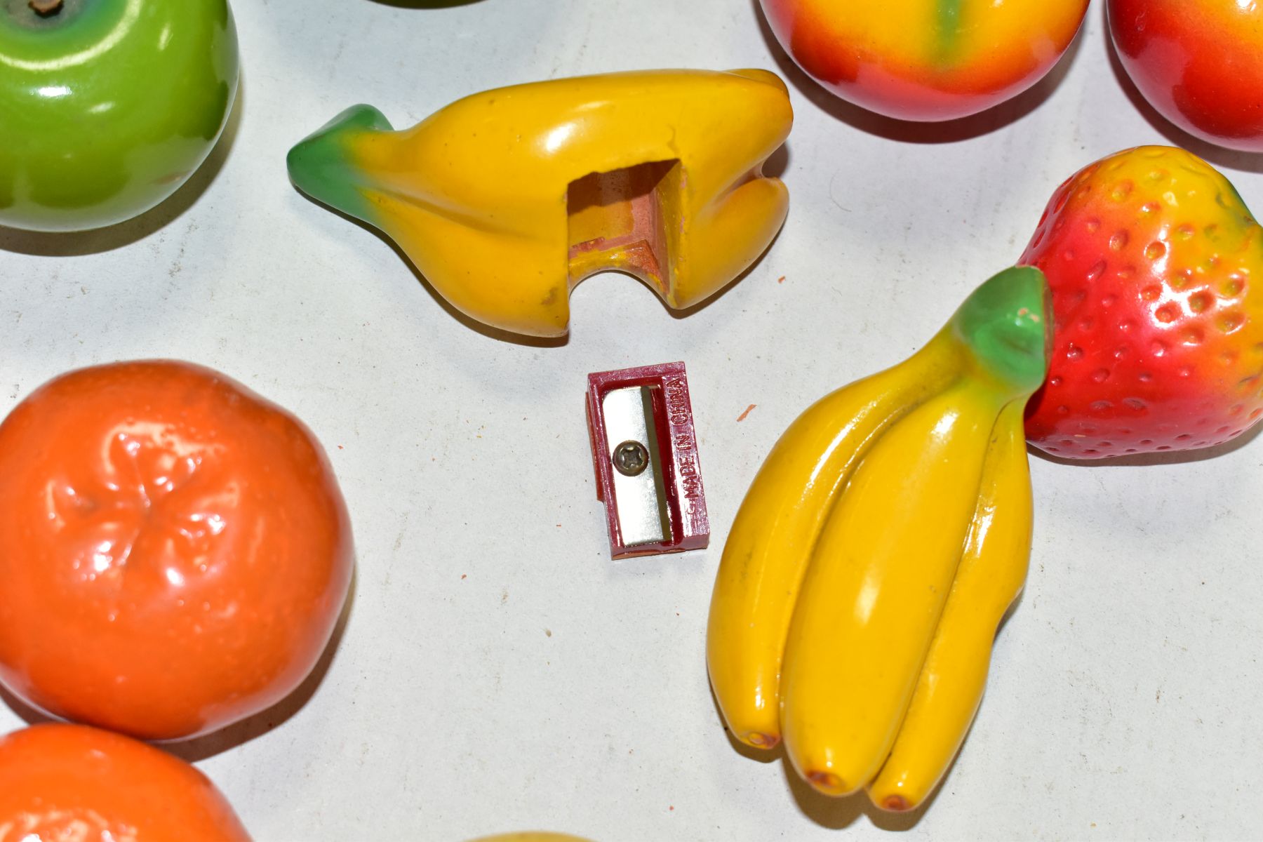 A BOX OF NOVELTY PENCIL SHARPENERS IN THE FORM OF FRUIT, the painted plaster fruit modelled as - Image 5 of 6