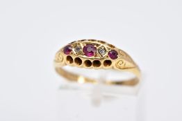 AN EARLY 20TH CENTURY DIAMOND AND RUBY RING, of a boat shape, set with three circular cut rubies,