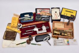 A BOX OF WATCH MAKERS TOOLS, to include a 'Brenray' demagnetiser, a small wooden container of