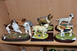 A GROUP OF SEVEN ROYAL DOULTON DOG FIGURES, comprising four boxed with plinths Beagle RDAII,