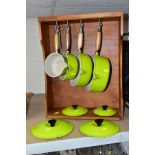 LE CREUESET, a set of four lime green graduated saucepans with lids, comprising sizes 14, 16, 20 and