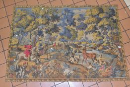 A 20TH CENTURY MACHINE MADE WALL HANGING TAPESTRY depicting a hunting scene, approximate size