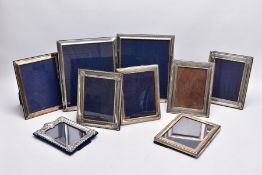 A SELECTION OF SILVER LINED PHOTO FRAMES, to include nine frames in total, of various designs and
