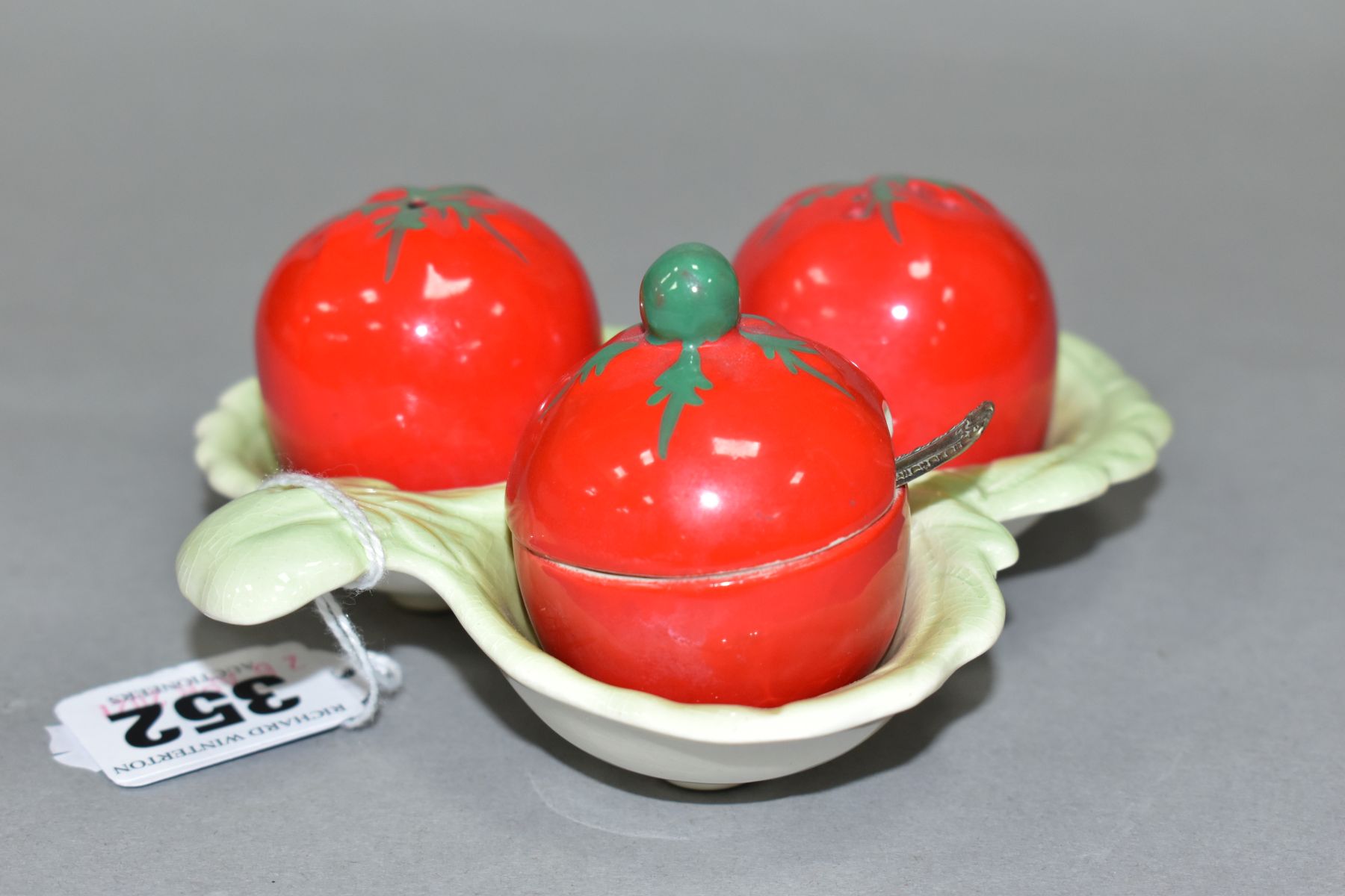 A CARLTON WARE AUSTRALIAN DESIGN CRUET IN THE FORM OF THREE TOMATOES ON A LEAF MOULDED STAND, salt - Image 6 of 6