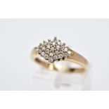 A 9CT GOLD CUBIC ZIRCONIA CLUSTER RING, of a lozenge form, set with circular cut cubic zirconia,