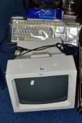 A VINTAGE IBM PS/1 TYPE 2011 PERSONAL COMPUTER with Dos 3.30 diskettes, monitor, keyboard, mouse,