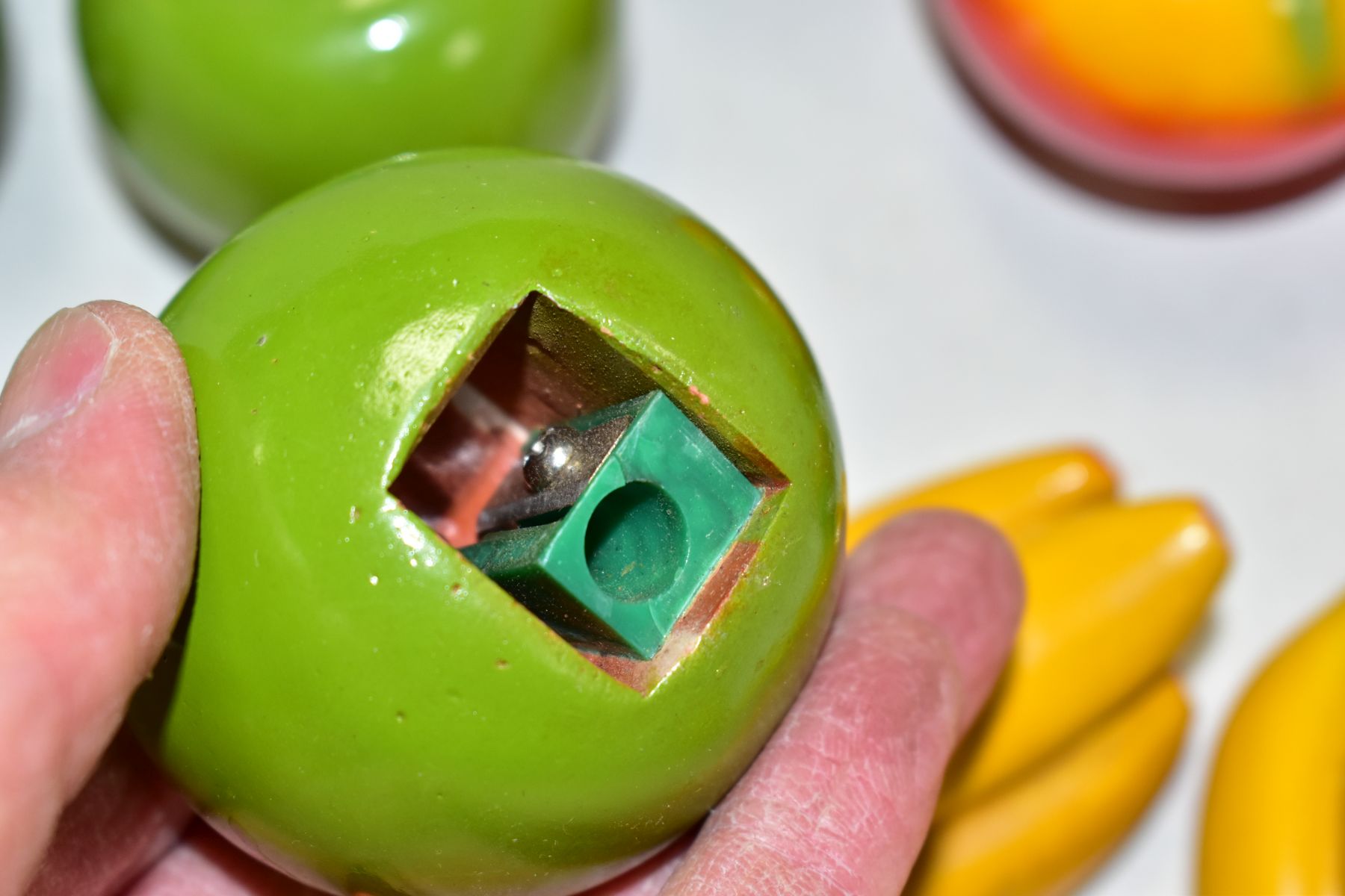 A BOX OF NOVELTY PENCIL SHARPENERS IN THE FORM OF FRUIT, the painted plaster fruit modelled as - Image 4 of 6