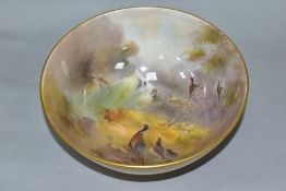 A ROYAL WORCESTER FOOTED BOWL PAINTED BY JAMES STINTON, the interior with a scene of cock and hen