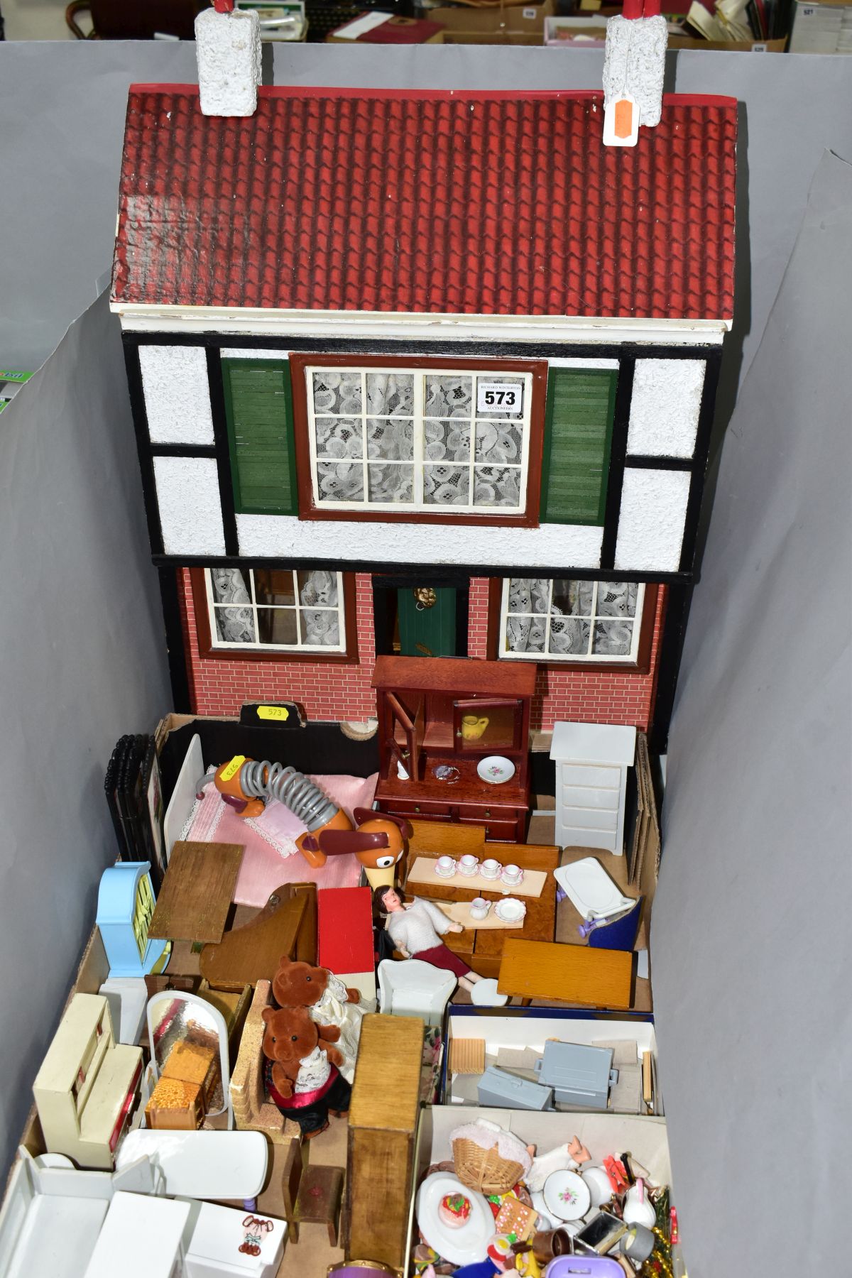 A WOODEN DOLLS HOUSE, modelled as a two storey town house, front opening to reveal two rooms,