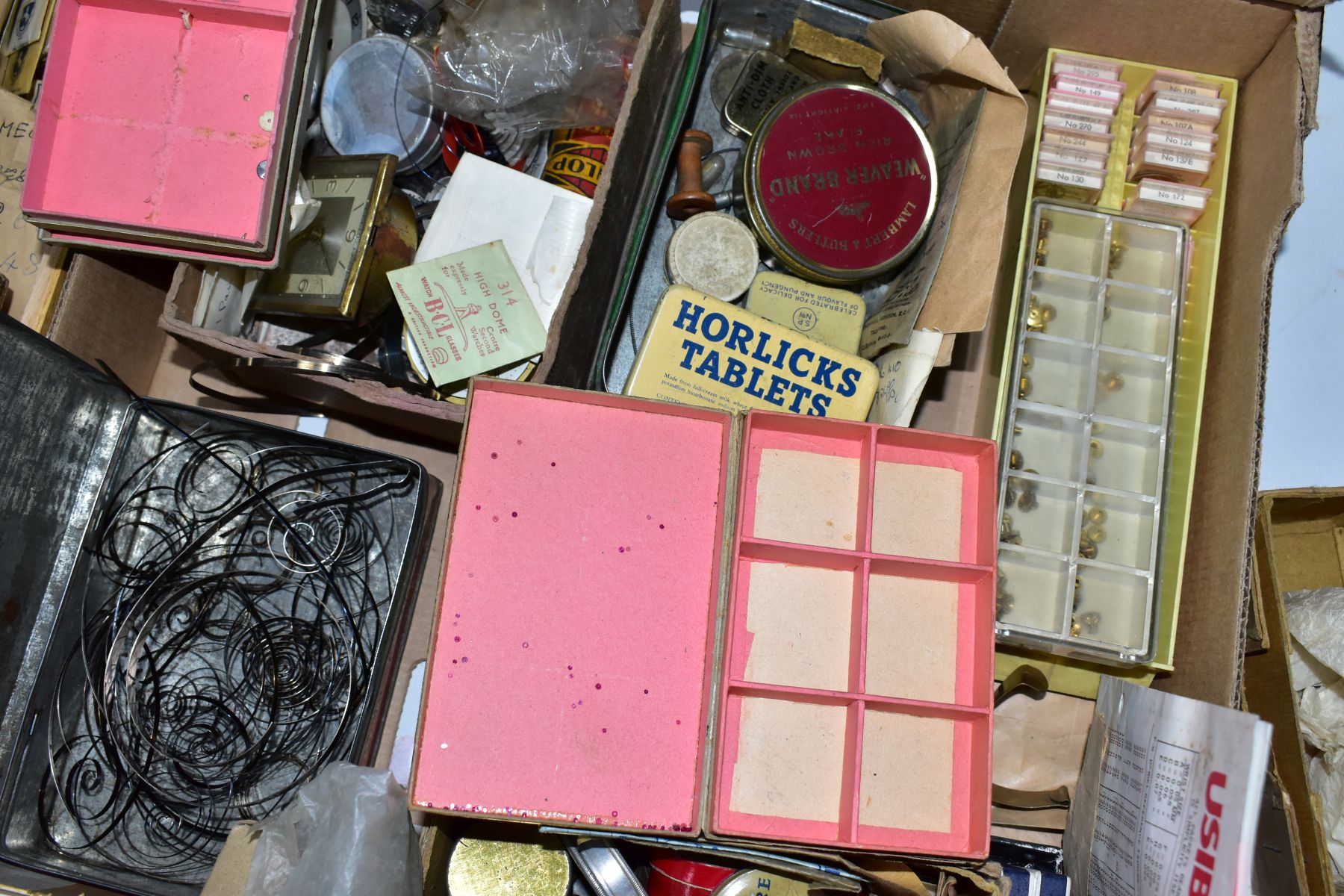 TWO BOXES OF ASSORTED WATCH MAKERS PARTS, GLASSES, COGS, SPRINGS, CROWNS, DECONSTTUCTED WATCH - Image 28 of 30