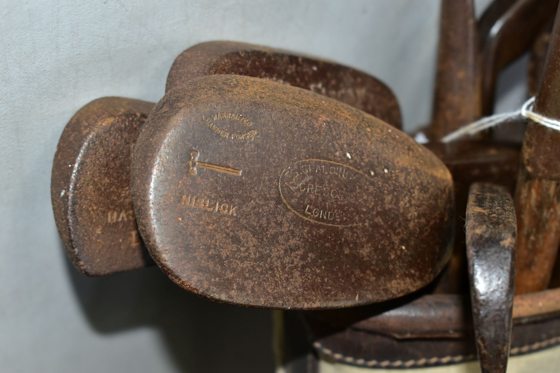 A VINTAGE CANVAS AND LEATHER TRIMMED GOLF BAG CONTAINING ELEVEN WOODEN SHAFTED GOLF CLUBS, brands - Image 5 of 7