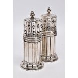 TWO GEORGE V SILVER SUGAR CASTERS, column form, wavy openwork base, pierced cover with a ball