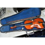 A CHINESE HALF SIZE VIOLIN IN CASE WITH BOW