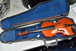 A CHINESE HALF SIZE VIOLIN IN CASE WITH BOW