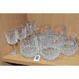 A SET OF SEVEN WATERFORD CRYSTAL LISMORE PATTERN WHISKY GLASSES, etched 'Waterford' mark, height 8.