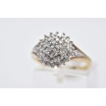 A 9CT GOLD DIAMOND CLUSTER RING, tiered cluster set with single cut diamonds, diamond detailed