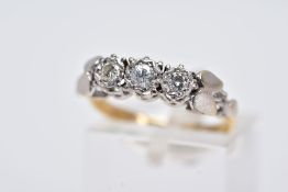 AN 18CT GOLD THREE STONE DIAMOND RING, designed with a row of illusion set round brilliant cut