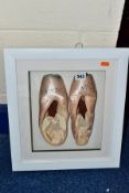 A PAIR OF FRAMED AND GLAZED PINK SATIN POINTE BALLET SHOES AUTOGRAPHED BY VICTORIA MARR former First