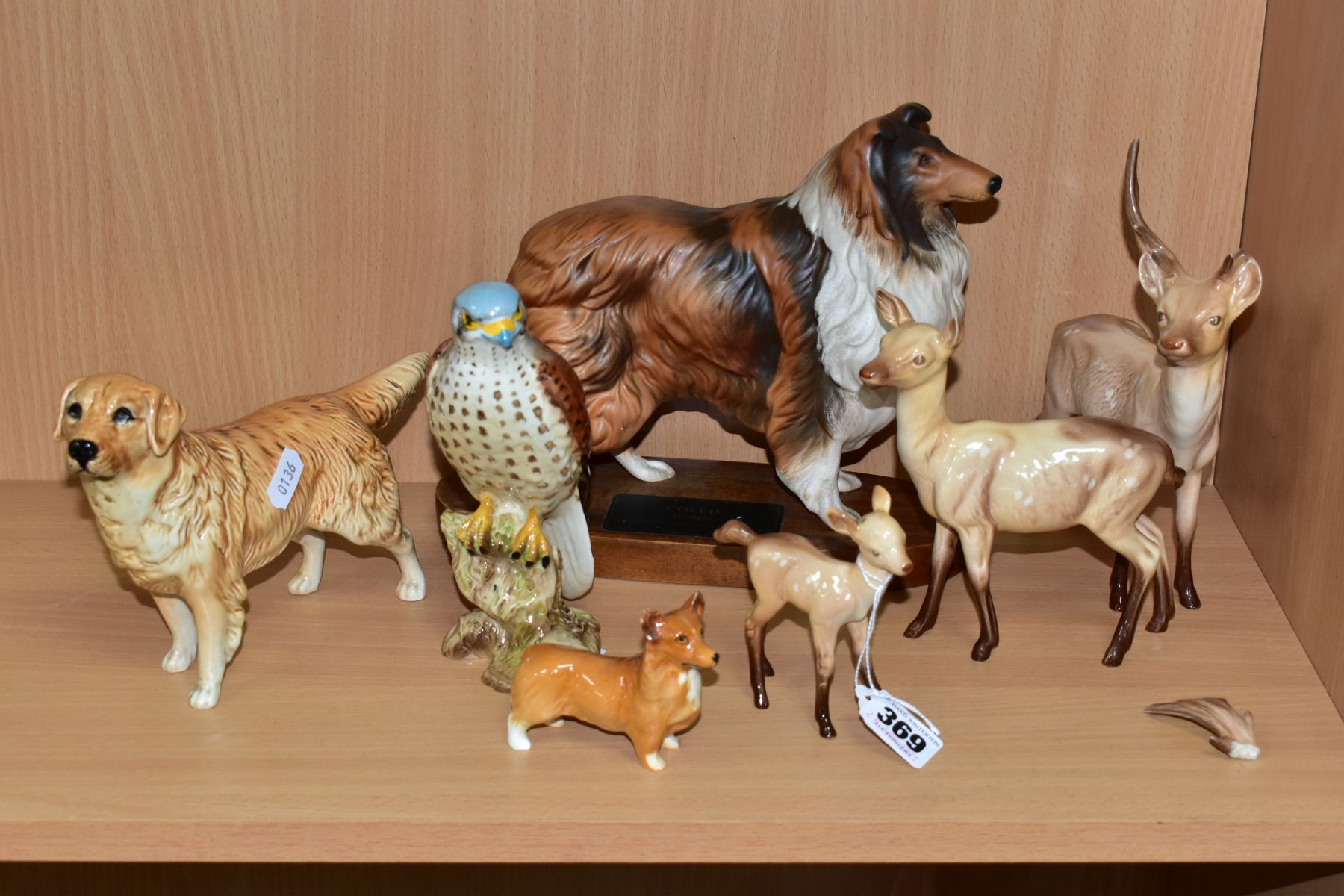 A COLLECTION OF SEVEN BESWICK ANIMAL AND BIRD FIGURES, comprising Stag, Doe and Fawn in light
