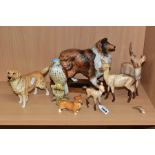 A COLLECTION OF SEVEN BESWICK ANIMAL AND BIRD FIGURES, comprising Stag, Doe and Fawn in light