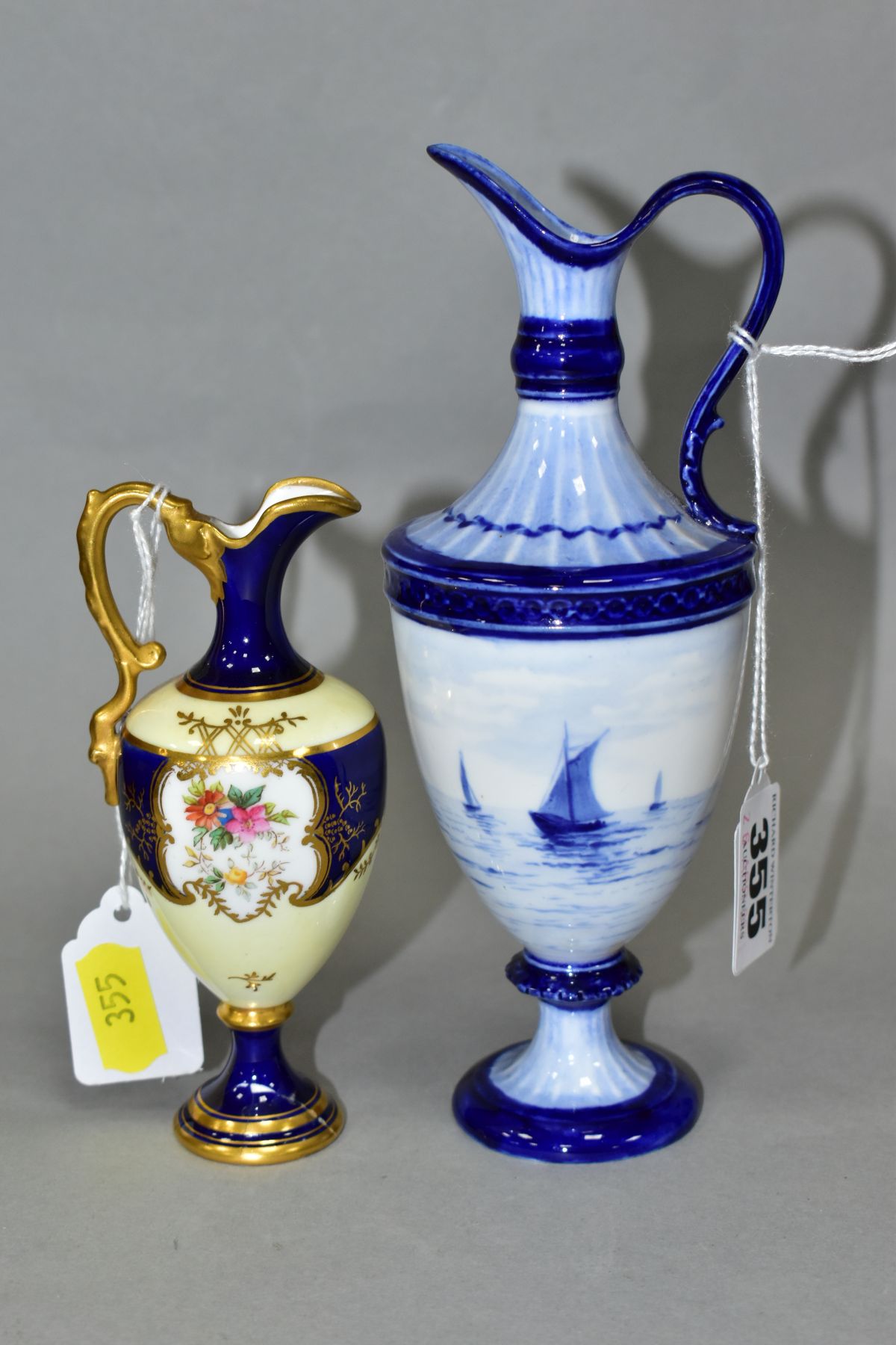 AN EARLY 20TH CENTURY COALPORT TOY EWER, blue and pale yellow ground with gilt detail and painted