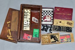 A WOODEN BOX CONTAINING A BOXED SET OF TSL BOXWOOD CHESSMEN, a boxed set of Crystalate dominoes,