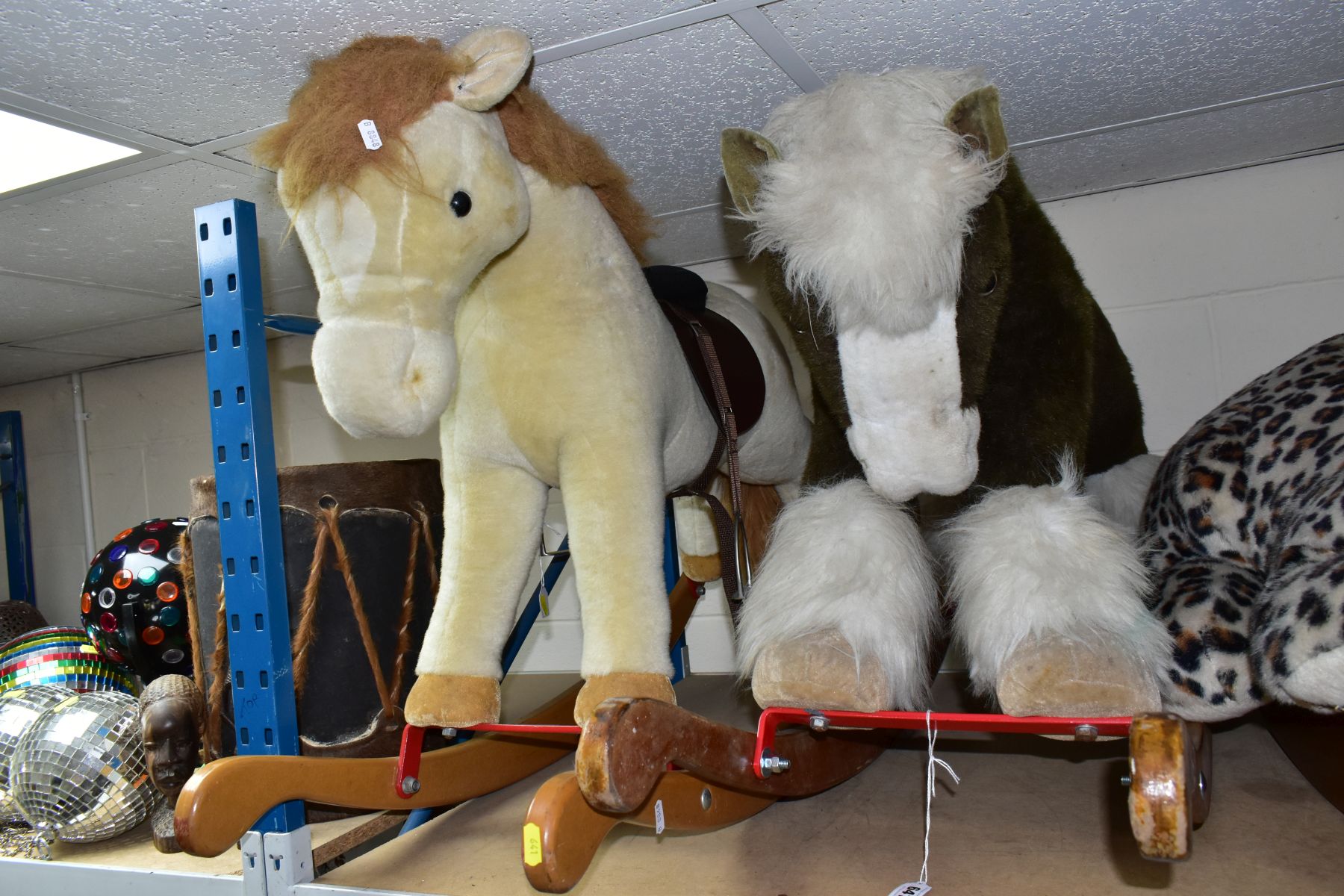 TWO MERRYTHOUGHT ROCKING HORSES, both in playworn condition with marking, wear and minor damage, one