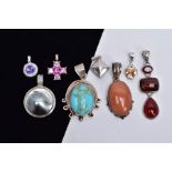 A BAG OF ASSORTED WITE METAL PENDANTS, eight pendants in total of various designs such as a