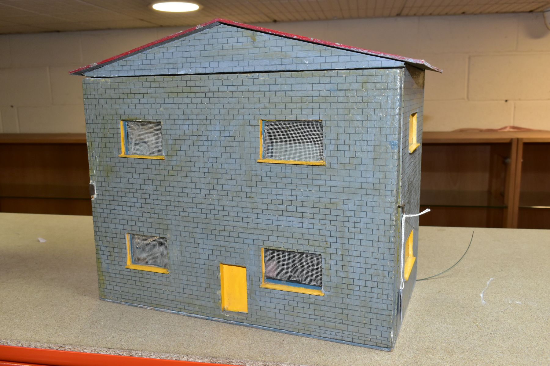 A SCRATCHBUILT WOODEN DOLLS HOUSE, modelled as a modern two storey detached house, removable