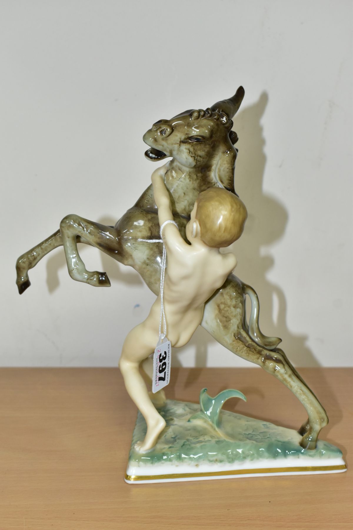 A 20TH CENTURY SELB HUTSCHENREUTHER FIGURE GROUP OF A DONKEY FOAL AND A SPRITE, on a triangular base - Bild 2 aus 9