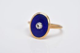 A SMALL GOLD VICTORIAN DIAMOND AND ENAMEL RING, centering on an old mine cut diamond, enclosed
