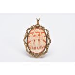 A 9CT GOLD CAMEO BROOCH/PENDANT, of an oval form depicting the three graces, within an openwork swag