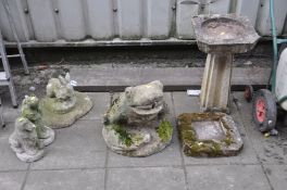 A LARGE COMPOSITE GARDEN ORNAMENT in the form of a frog 42cm high, a Bird Bath and three smaller