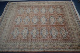 A HAND KNOTTED JALDAR CARPET SQUARE, with russet ground, 337cm x 258cm
